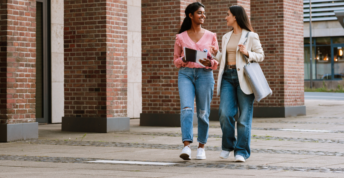 Adult-Autism 2 women walking down a street in conversation