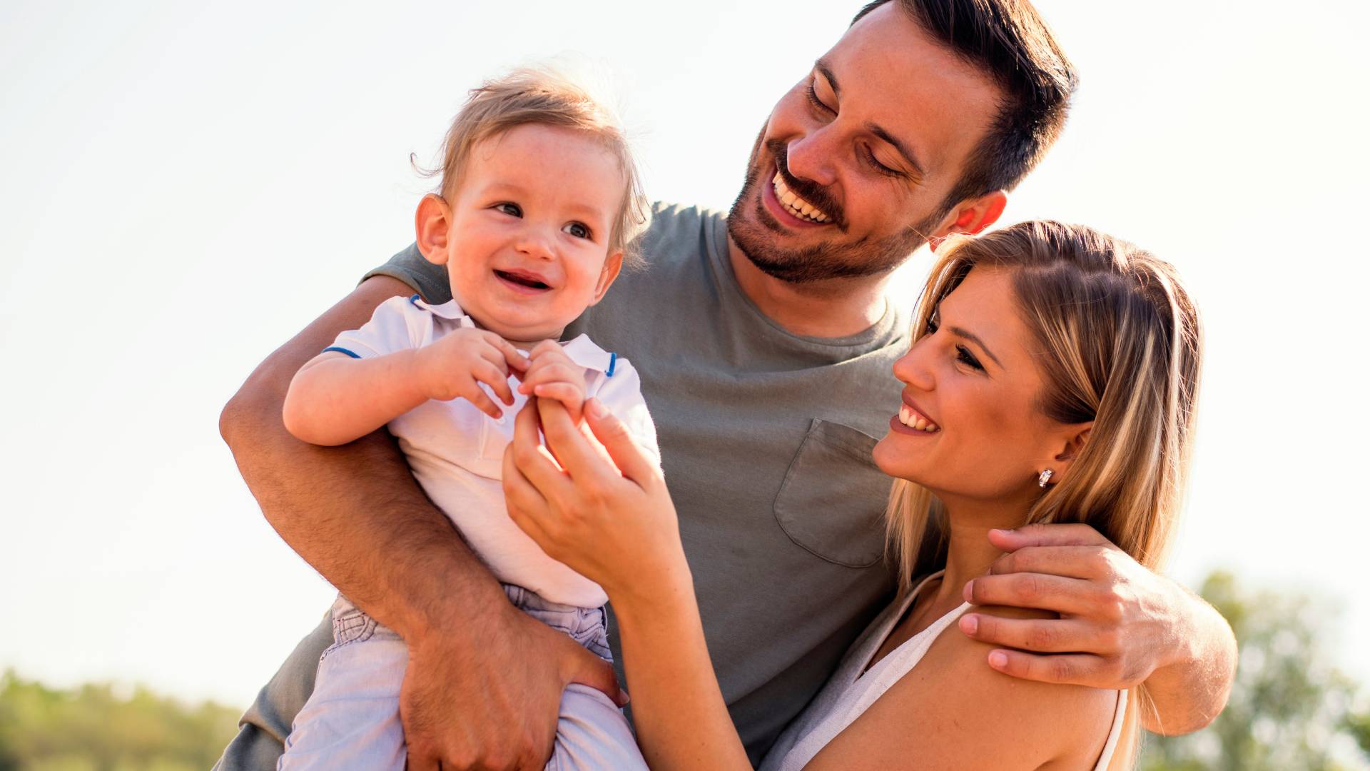 About KPI a couple holding a baby
