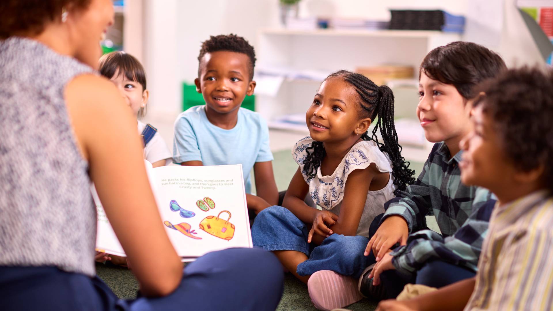 AdobeStock_576011546 children listening to a story