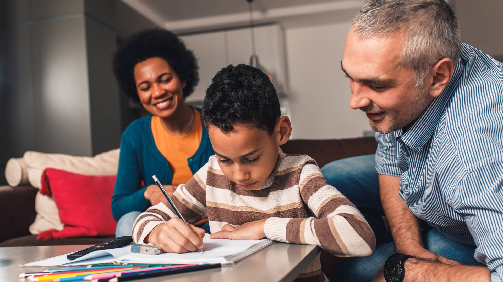 Working together for people, families and communities two adults helping a child with their homework