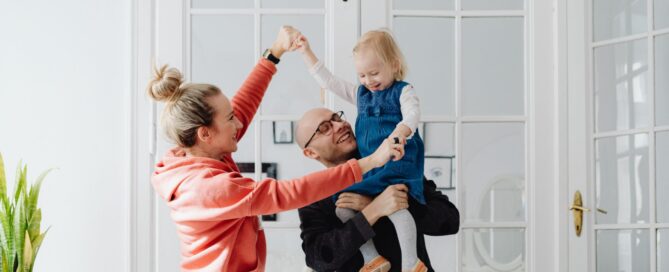 Family happily playing together