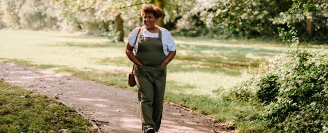 woman walking through a park