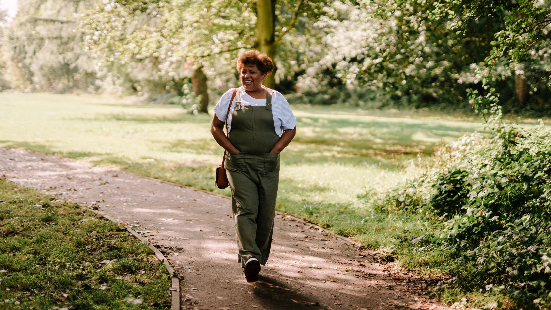 woman walking through a park