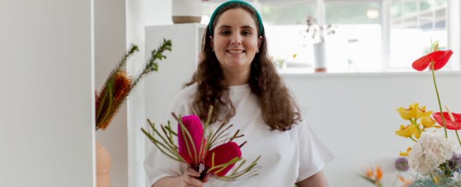 Adult holding a flower