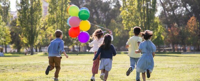 children playing with balloons