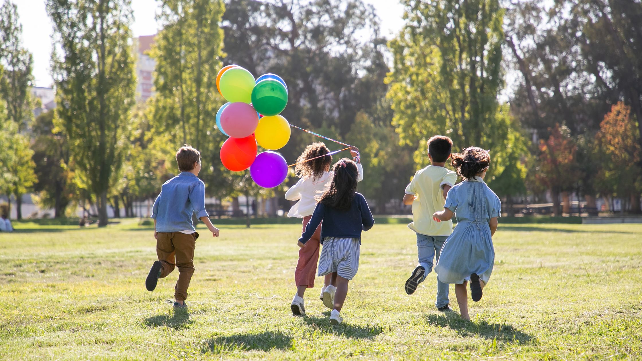 children playing with balloons